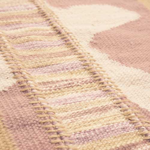 Stitched Petal and Space Dye Flatweave Rug close up