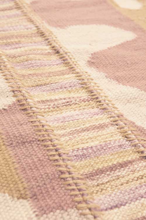 Stitched Petal & Space Dye Flatweave Rug close up